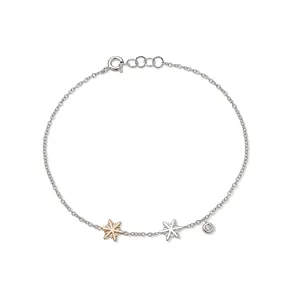 Bracelet Flocon d'Amour en Or 750 mill.  et Blanc 750 mill. serti de Diamant 0.015ct.